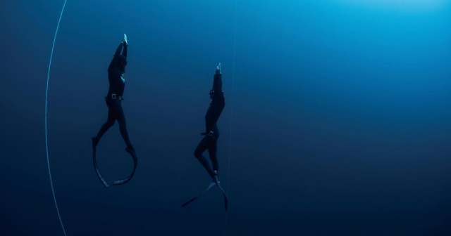 two divers under water